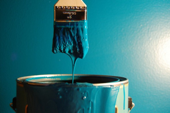 Paintbrush dipping in paint can - 5 Cheap and Easy Ways to Boost Your Home's Value