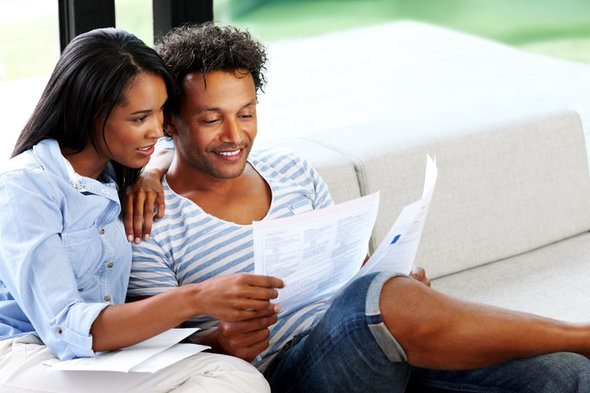 A married couple checks their tax returns