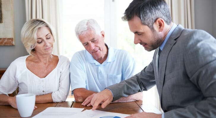 A financial advisor explaining the difference between a pension vs. an annuity with their clients.