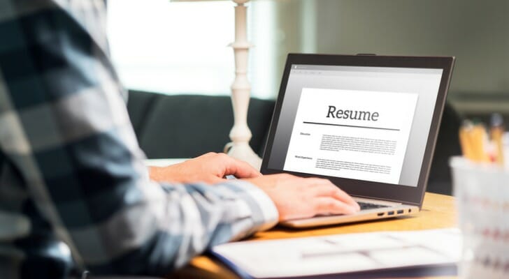 Image shows the hands of a person editing a resume file on a laptop. SmartAsset analyzed BLS data to conduct this year's study on the fastest-growing job in each state.