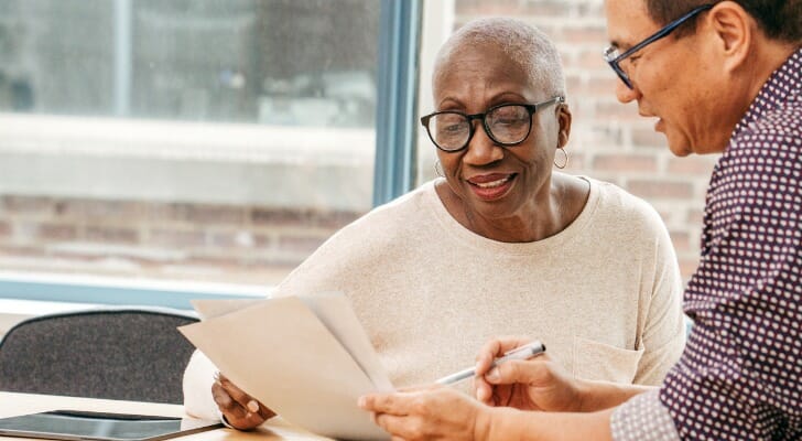 A financial advisor discusses with his client changing the executor of her estate.