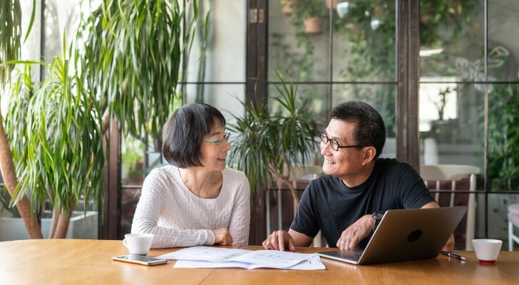 Asian couple plans their retirement