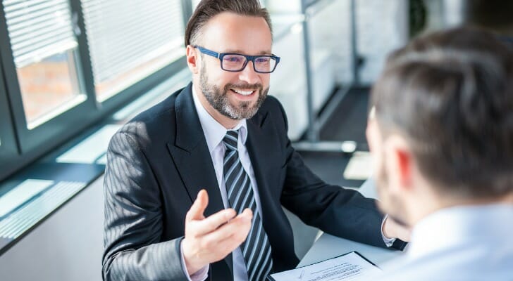 Financial advisor talks with client