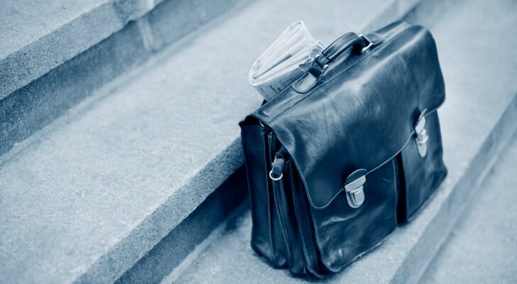 Briefcase and newspaper