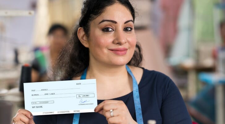 Woman with a dividend check