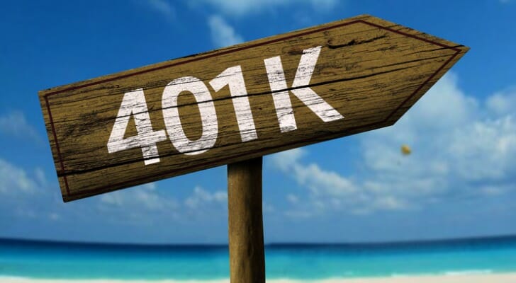 Wooden 401(k) sign on a beach