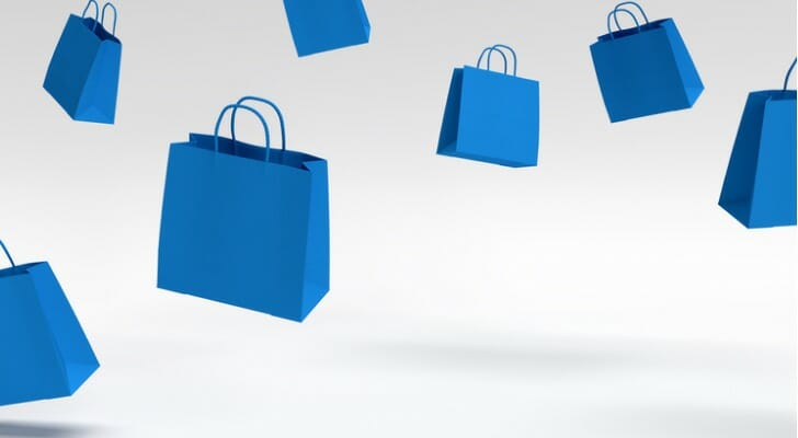 Blue shopping bags floating in the air