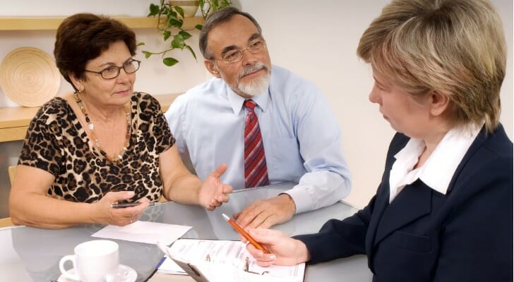 Couple discusses a retirement trust with their financial advisor