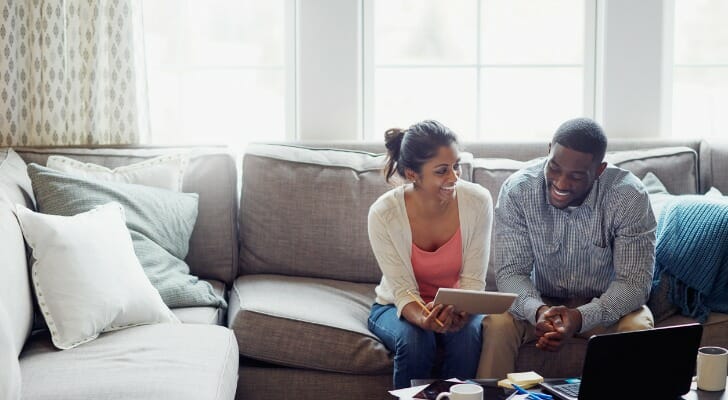 A young couple discusses whether to open a joint brokerage account
