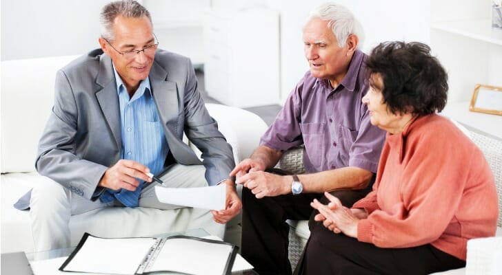 Older couple working with their financial advisor on a discretionary trust