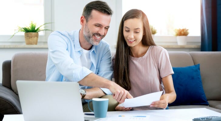Man discusses his tax-saving strategies with his daughter