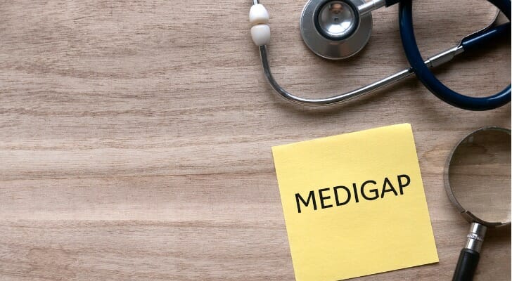 "MEDIGAP" written ona card with a stethoscope next to it