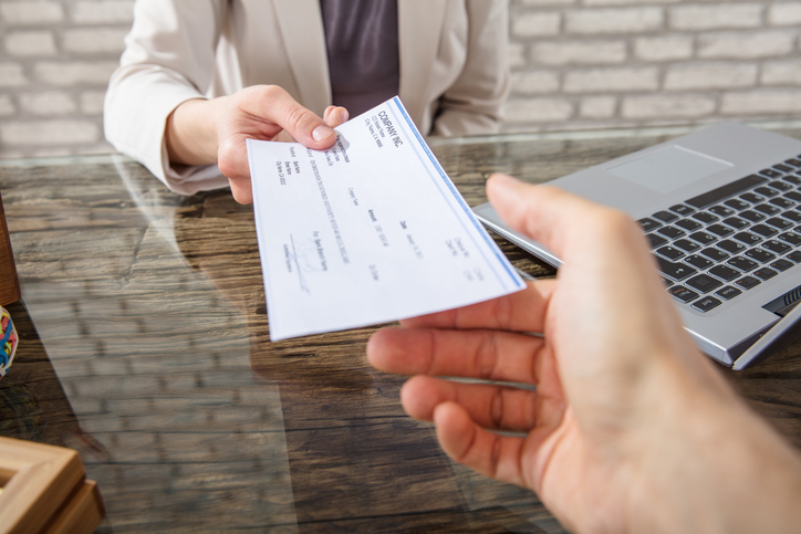 SmartAsset: What is a returned check fee?