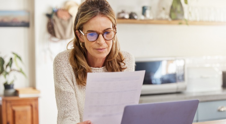 Woman looking at her retirement investments