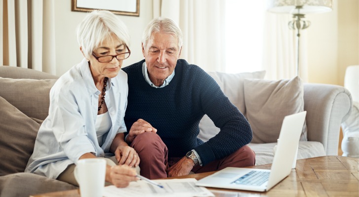 A married couple reviews their 401(k) accounts. 