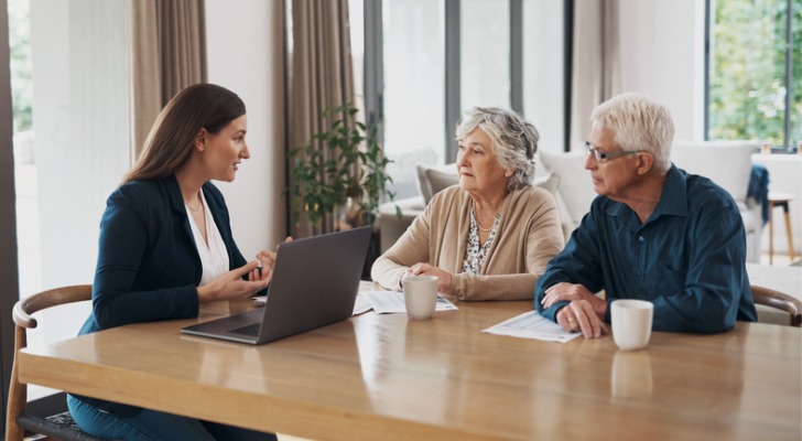 Financial advisor working with two of her clients