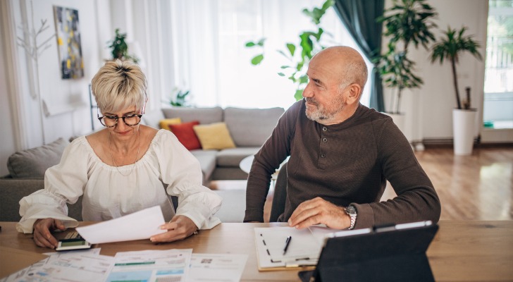 A couple reviews their finances and plan for retirement. 