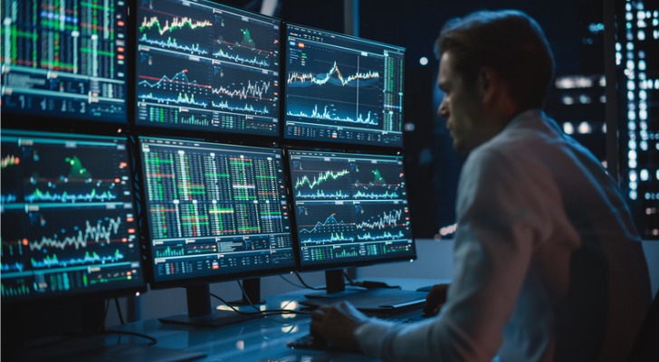 A trader looks over a variety of trade signals.