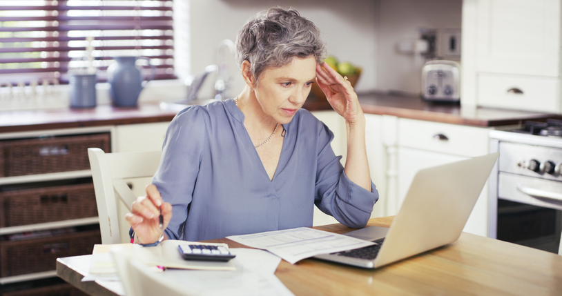 Woman contemplates how much to leave in her checking account
