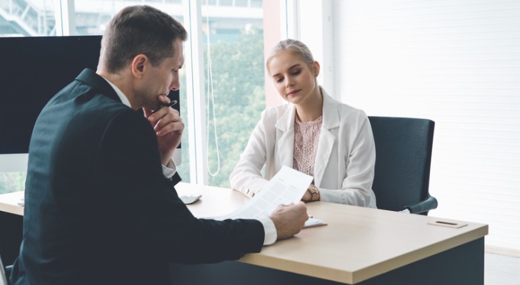A woman interviewing a potential financial advisor to join her firm