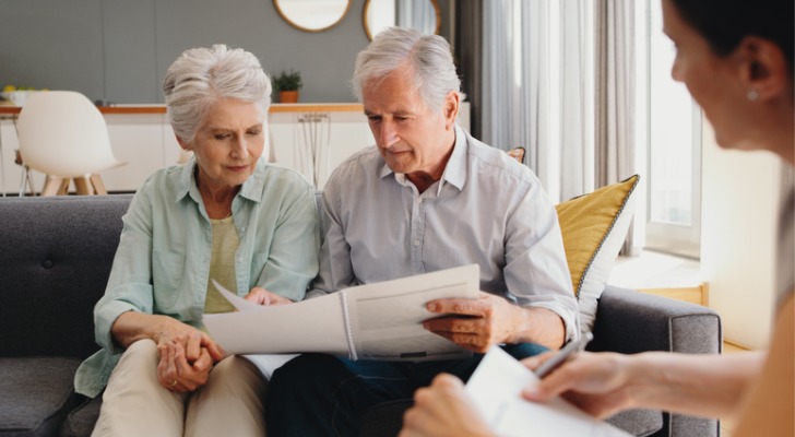 A couple goes over their estate plan with their financial advisor. 