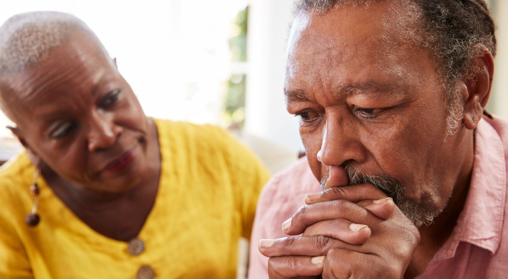 Older black couple thinking about how to increase their retirement savings