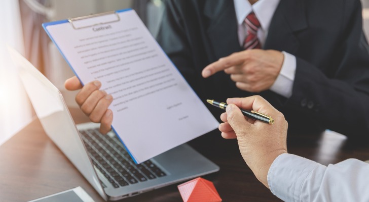 A buyer reviewing a contract before closing on a home.