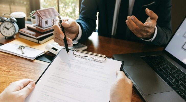 A homebuyer reviewing a purchase agreement. 