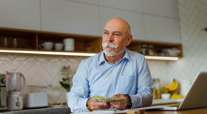 An older man deciding whether to open a retirement money market account