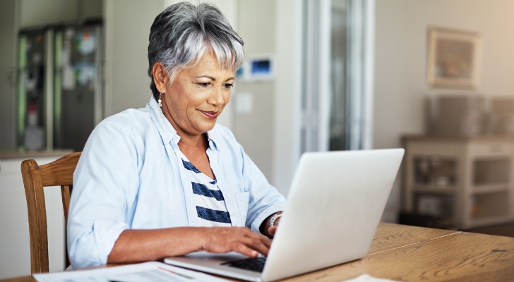 A woman looking up the differences between a Simple IRA and a Roth IRA