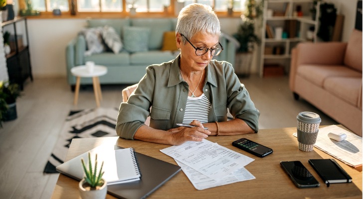 A retiree reviews her finances to see how she can respond to rising inflation.