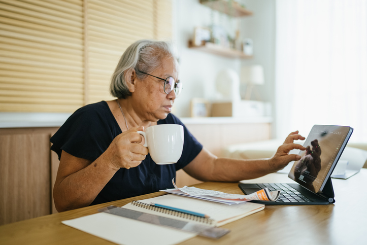A senior woman reviewing her retirement savings.