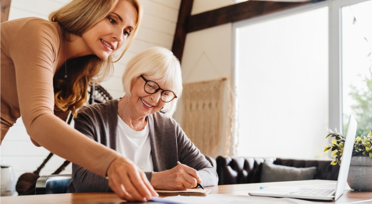 A mother and daughter compiling an inventory to calculate the average value of personal property for insurance.