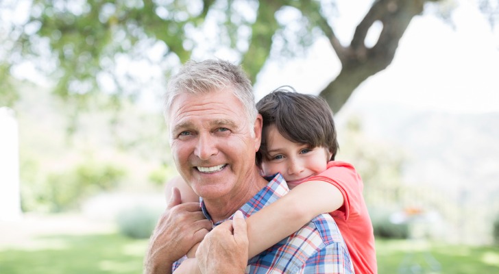 Man thinking about retirement in 10 years with his oldest grandchild.