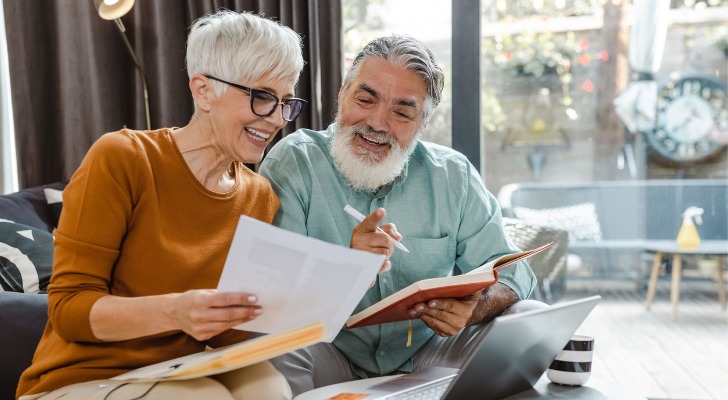 A senior couple reviewing their net worth at retirement