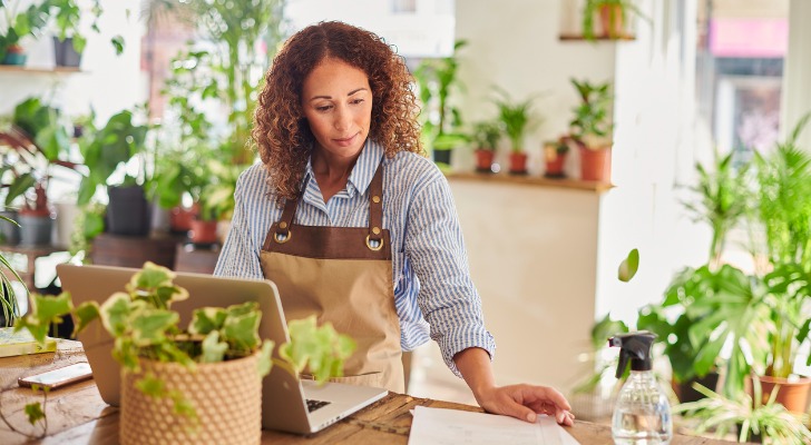 A florist looks over her retirement savings in her solo 401(k).