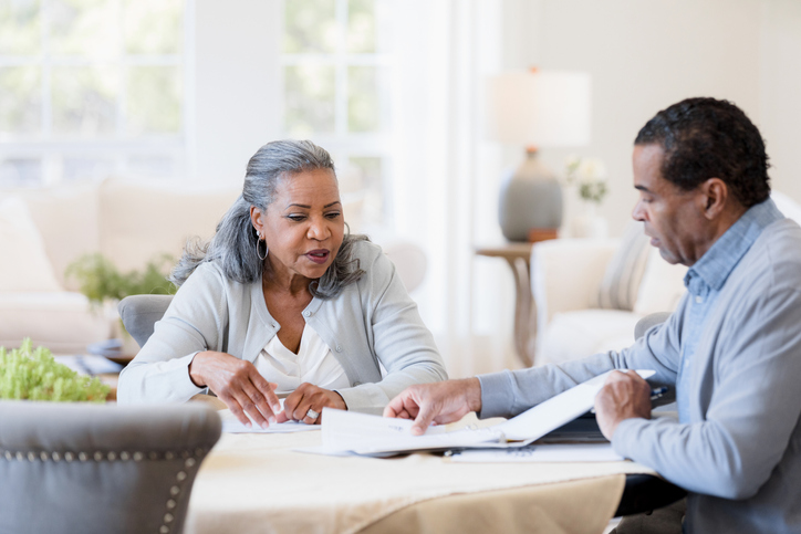 A senior couple reviewing estate planning strategies to avoid probate in Washington state.