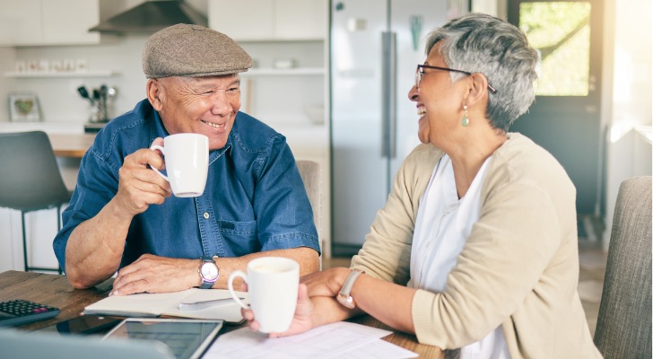 A senior couple reviewing the benefits of their joint annuity.