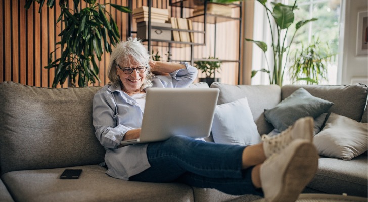 A senior reviewing how much her Roth IRA account has earned tax-free.
