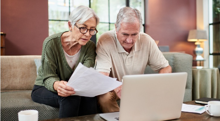 A senior couple reviewing the terms of their joint annuity.