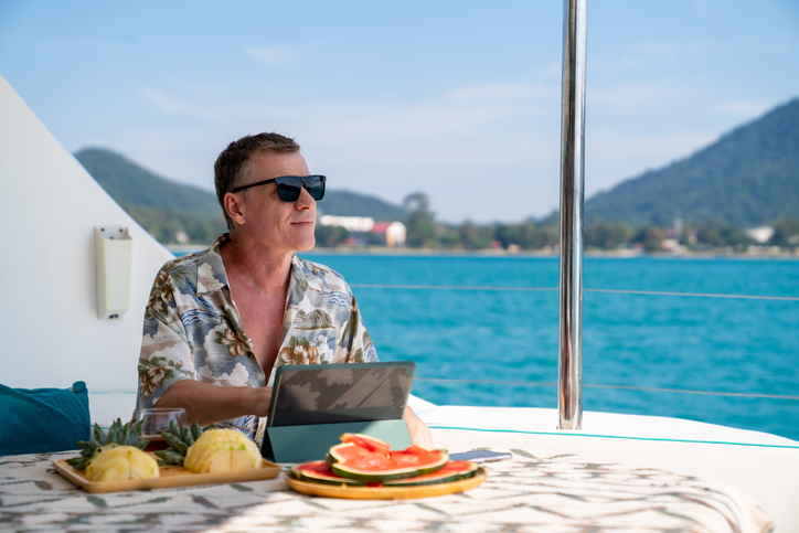 An ultra-high-net-worth individual working remotely from his summer home.