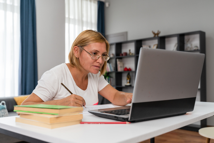 A woman researching different types of annuities.