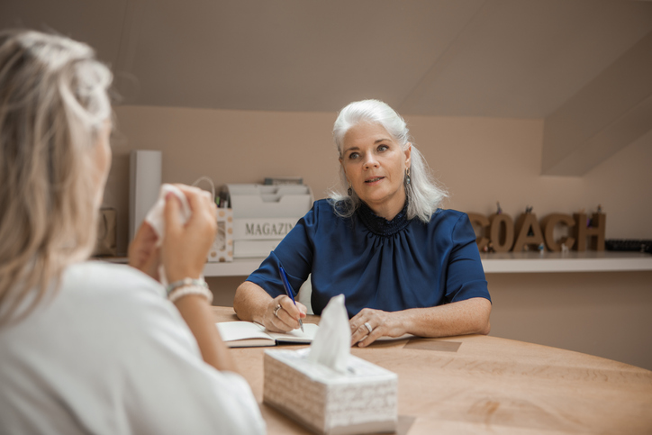 A surviving spouse consulting a financial advisor about tax requirements for an inherited IRA.