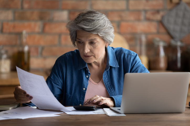 A senior calculating how much she will have to pay in taxes for payments from her annuity. 