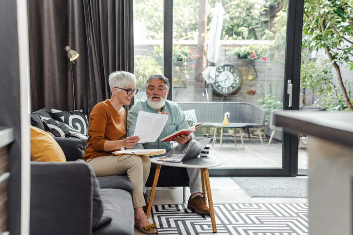 A senior couple reviewing their retirement plan. 