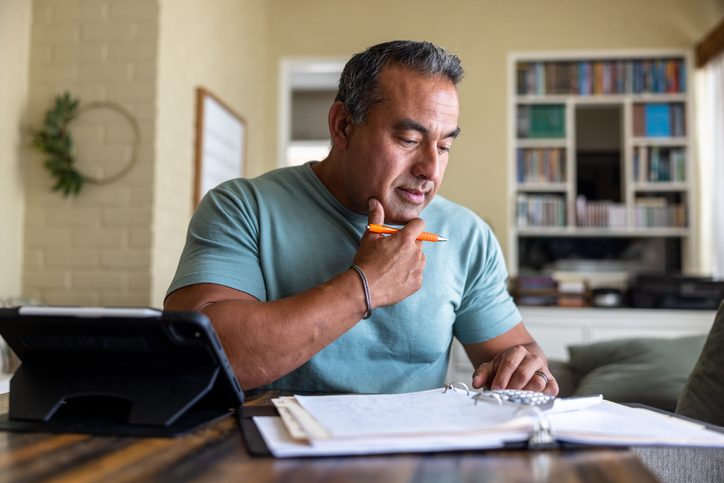 A man determining whether he should invest in a tax-deferred annuity.