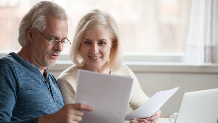 A couple goes over their monthly budget and determines how much income they need to generate in retirement to meet these recurring expenses. 
