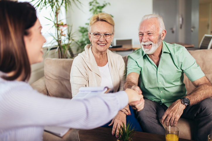 A senior couple consulting a financial advisor to get estate planning advice that could help them avoid probate in Missouri.