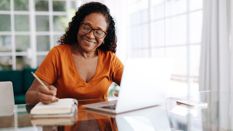 A 60-year-old woman looks over her finances and calculates how long her savings could last. 