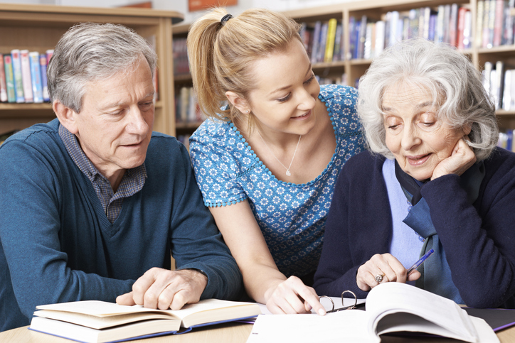 A senior couple meeting with a financial advisor to discuss a power of attorney in Missouri.
